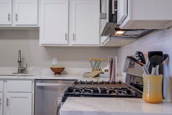 Kitchens with custom cabinetry and gleaming quartz countertops*